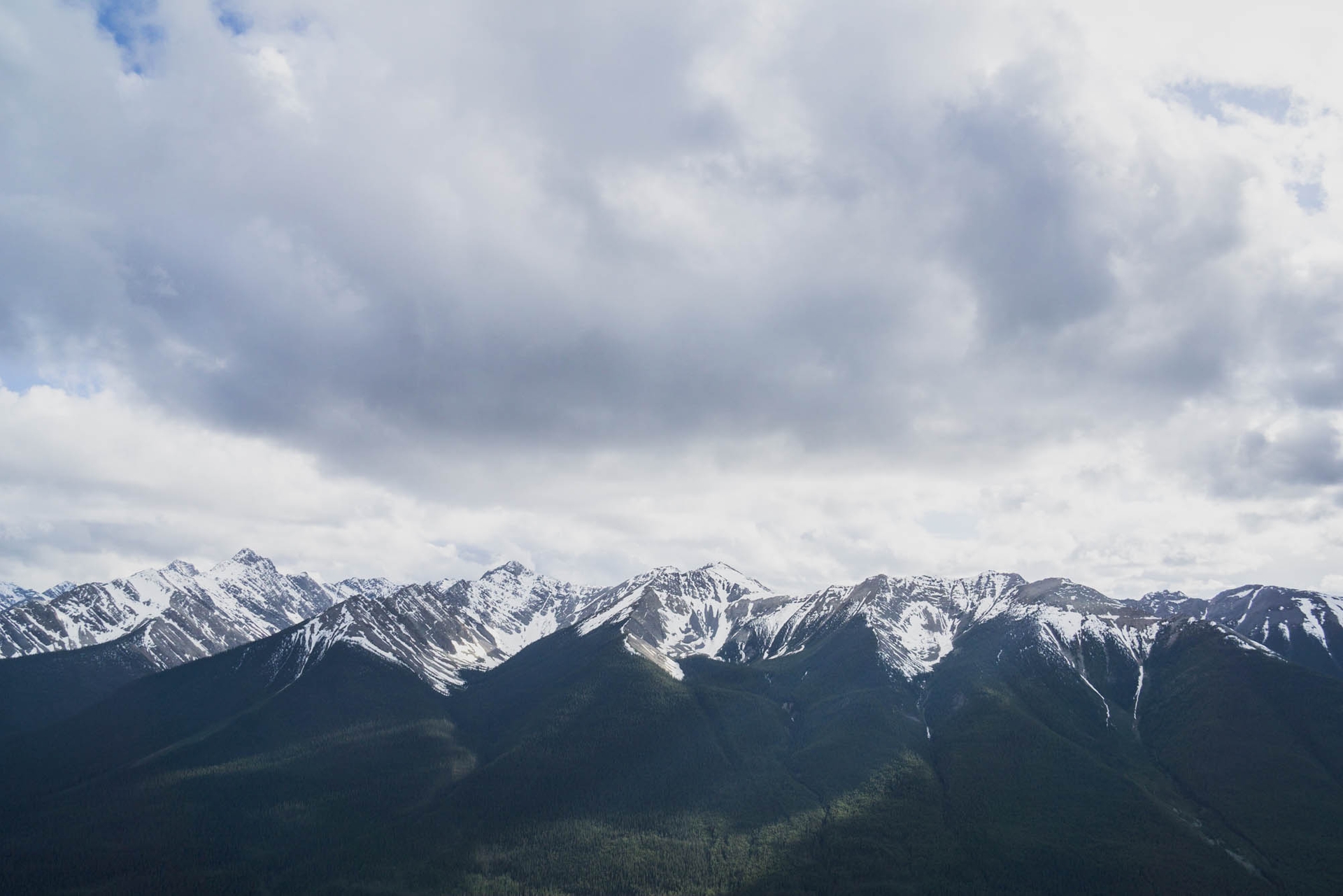 A view of the Canadian Rocky Mountains at the top of the Banff Gondola in Alberta, Canada