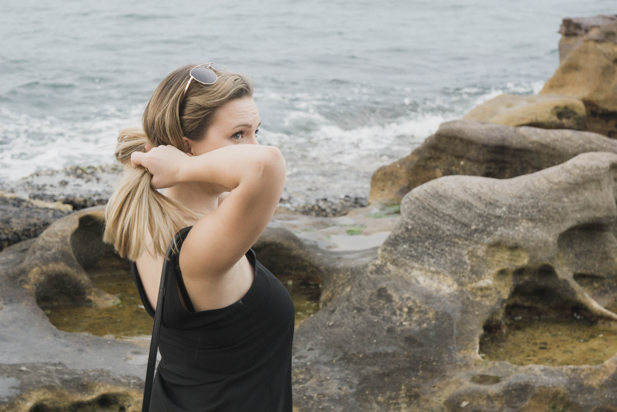 Jami on a rocky beach in Sydney, Australia